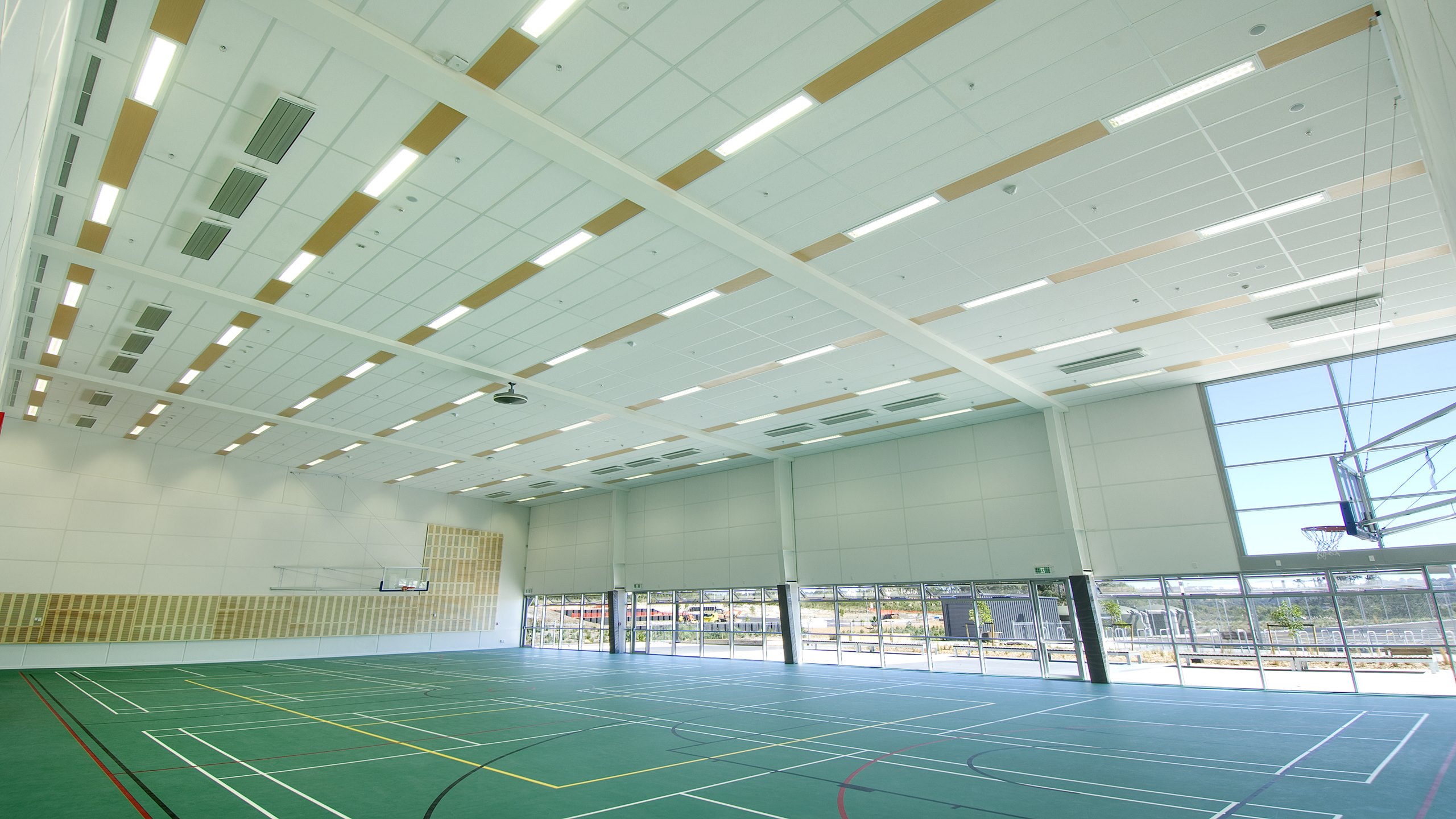 Hobsonville Point Intermediate School Gymnasium showing Triton Sports panels installed between lighting strips